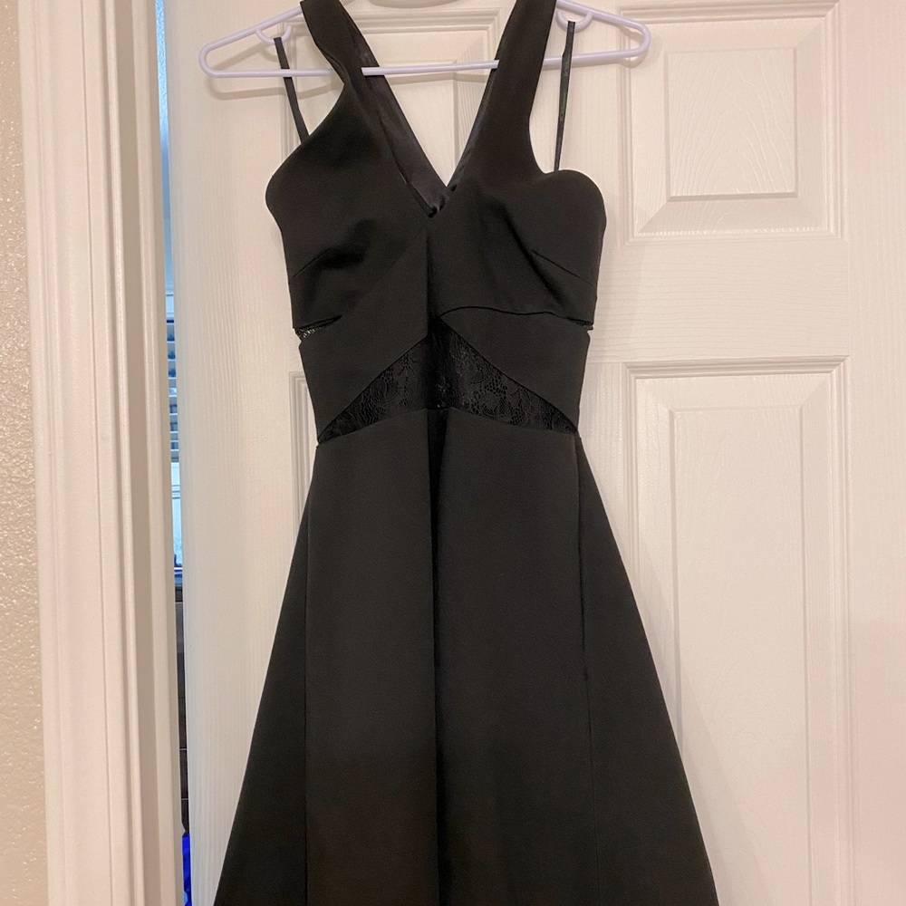 BCBG MaxAzria Dress with lace cutouts NWT! Stylish and elegant.